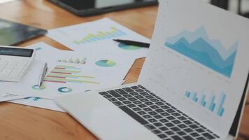 Financial analysts analyze business financial reports on a digital tablet planning investment project during a discussion at a meeting of corporate showing the results of their successful teamwork. video