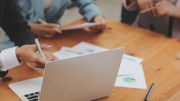 Financial analysts analyze business financial reports on a digital tablet planning investment project during a discussion at a meeting of corporate showing the results of their successful teamwork. video