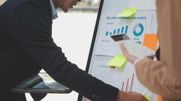 Financial analysts analyze business financial reports on a digital tablet planning investment project during a discussion at a meeting of corporate showing the results of their successful teamwork. video