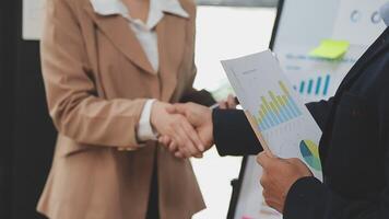 Financial analysts analyze business financial reports on a digital tablet planning investment project during a discussion at a meeting of corporate showing the results of their successful teamwork. video