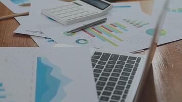 Financial analysts analyze business financial reports on a digital tablet planning investment project during a discussion at a meeting of corporate showing the results of their successful teamwork. video