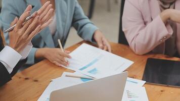 Financial analysts analyze business financial reports on a digital tablet planning investment project during a discussion at a meeting of corporate showing the results of their successful teamwork. video