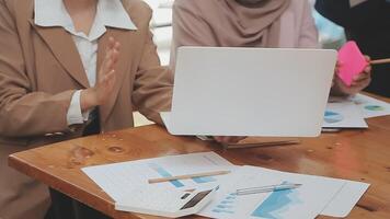 Financial analysts analyze business financial reports on a digital tablet planning investment project during a discussion at a meeting of corporate showing the results of their successful teamwork. video