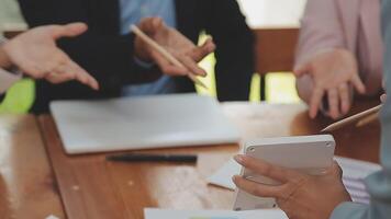 Financial analysts analyze business financial reports on a digital tablet planning investment project during a discussion at a meeting of corporate showing the results of their successful teamwork. video
