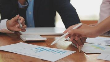 Financial analysts analyze business financial reports on a digital tablet planning investment project during a discussion at a meeting of corporate showing the results of their successful teamwork. video