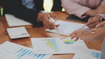 Financial analysts analyze business financial reports on a digital tablet planning investment project during a discussion at a meeting of corporate showing the results of their successful teamwork. video