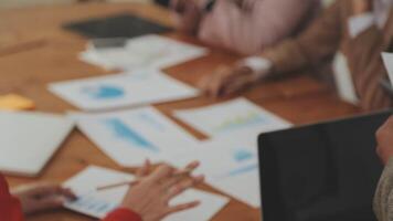 Financial analysts analyze business financial reports on a digital tablet planning investment project during a discussion at a meeting of corporate showing the results of their successful teamwork. video