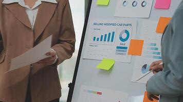 Financial analysts analyze business financial reports on a digital tablet planning investment project during a discussion at a meeting of corporate showing the results of their successful teamwork. video