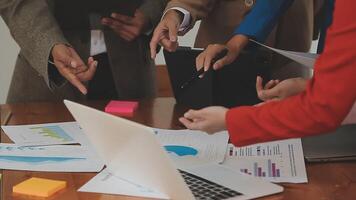 Financial analysts analyze business financial reports on a digital tablet planning investment project during a discussion at a meeting of corporate showing the results of their successful teamwork. video
