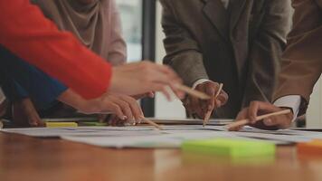 Financial analysts analyze business financial reports on a digital tablet planning investment project during a discussion at a meeting of corporate showing the results of their successful teamwork. video