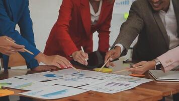 Financial analysts analyze business financial reports on a digital tablet planning investment project during a discussion at a meeting of corporate showing the results of their successful teamwork. video
