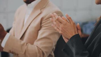 Happy, business people and hands clapping at meeting with notebooks in office for seminar or trade show. Smile, corporate group and conference with applause in boardroom for training interns video