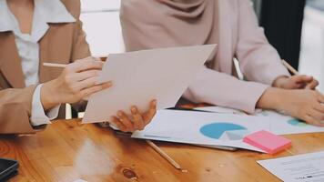 Team of business people are meeting to analyze data for marketing plan,Market research reports and income statistics, Financial and Accounting concept. video
