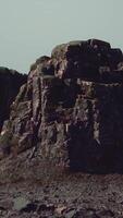 A large rock outcropping in the middle of the desert video