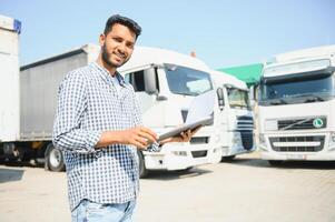 Logistics, delivery car and man with clipboard paperwork or checklist for stock, product distribution or shipping info. Supply chain industry, courier service and happy van or truck driver working photo