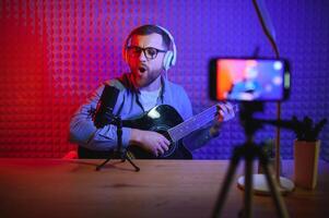 Man singing in a recording studio photo