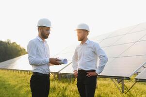 Project manager discuss with worker installation process of solar panel photo
