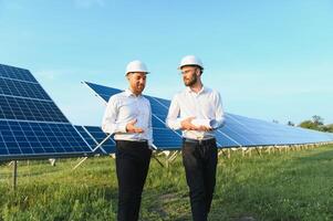 Project manager discuss with worker installation process of solar panel photo