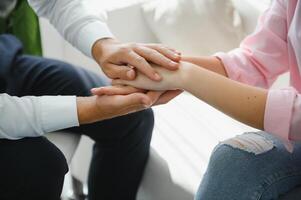 close-up of a female doctor's hands hugging the patient's hands. A gesture of support. Psychological assistance to a woman photo