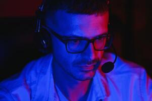 Handsome young male software developer programming codes while working from home photo
