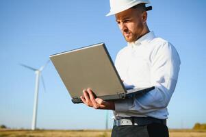 Power engineer are working with wind turbines. photo