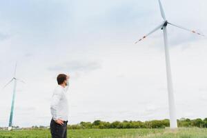 Windmill engineer inspection and progress check wind turbine at construction site. photo