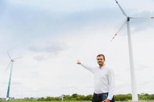 Windmill engineer inspection and progress check wind turbine at construction site. photo