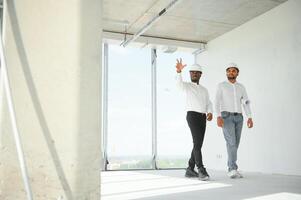 Group of multi ethnic engineer construction site worker meeting at workplace photo