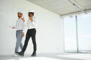 Group of multi ethnic engineer construction site worker meeting at workplace photo