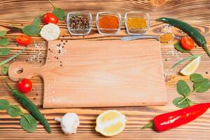 Cooking table. Background with spices and vegetables. Top view. Free space for your text photo