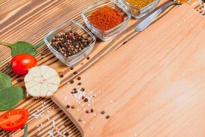 Cooking table. Background with spices and vegetables. Top view. Free space for your text photo