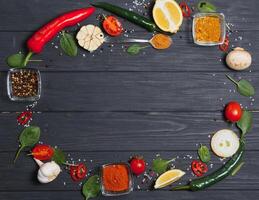 Cooking table. Background with spices and vegetables. Top view. Free space for your text photo