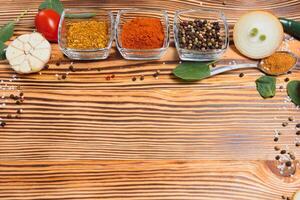 Cooking table. Background with spices and vegetables. Top view. Free space for your text photo