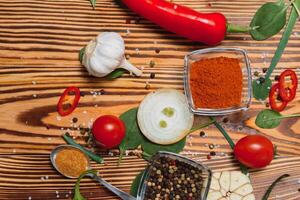 Spices and herbs over wooden background, healthy or cooking concept photo
