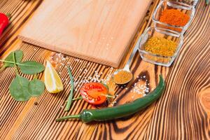 Cooking table. Background with spices and vegetables. Top view. Free space for your text photo