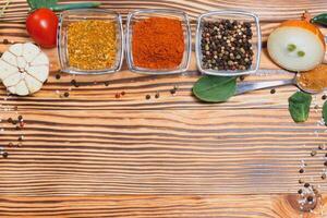 Cooking table. Background with spices and vegetables. Top view. Free space for your text photo