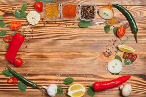 Cooking table. Background with spices and vegetables. Top view. Free space for your text photo