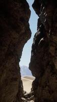 A narrow passage between two large rocks video