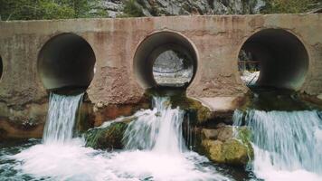 Drone view captures mountain stream as vital resource. Clear water showcases natural resource in rocky terrain. Aerial footage emphasizes stream as sustainable resource video