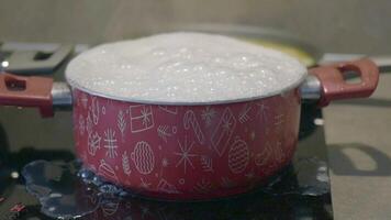 Cooking Mishap Boiling Pot Overflowing, causing a messy accident at home. Immediate cleanup needed video