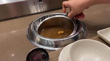 preparing a mushroom dish enoki mushrooms are boiled in a pan Enoki mushrooms Also known as winter mushrooms. These long, thin, tender mushrooms grow in clusters all year round. video