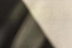 Full frame of a bright sunny orange wall with shadows and texture background photo