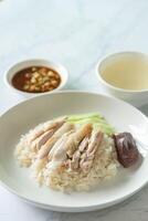 Closed up Chicken rice as Singapore street food with salted soya beans sauce and soup photo
