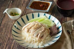 Closed up Hainanese Chicken rice with salted soya beans sauce and soup photo