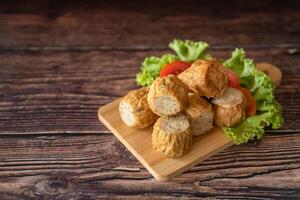 Closed up deep fried chicken roll as Chinese-Thai fusion style serve with sweet sauce photo