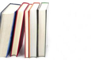 Stack of books on white background.Knowledge, learning and education concept. photo