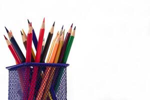 Crayon or colored pencils in box on white background. Knowledge and education concept. photo