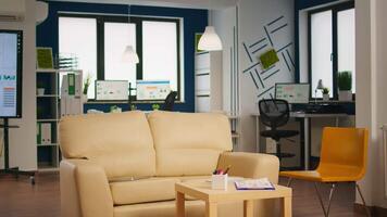 Empty start up business office with modern design and confortable couch. Financial company with nobody in it, place of work startup, workplace indoors concept video