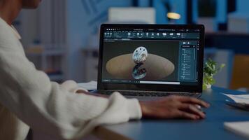 African woman engineer working at new project using laptop doing overtime at night sitting at desk in start-up office. Industrial construction designer studying on pc showing cad software in midnight video