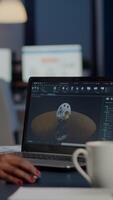 Excited black woman industry architect working on modern cad program overtime sitting in start-up office. Industrial engineer studying prototype idea on pc showing cad software on device display video